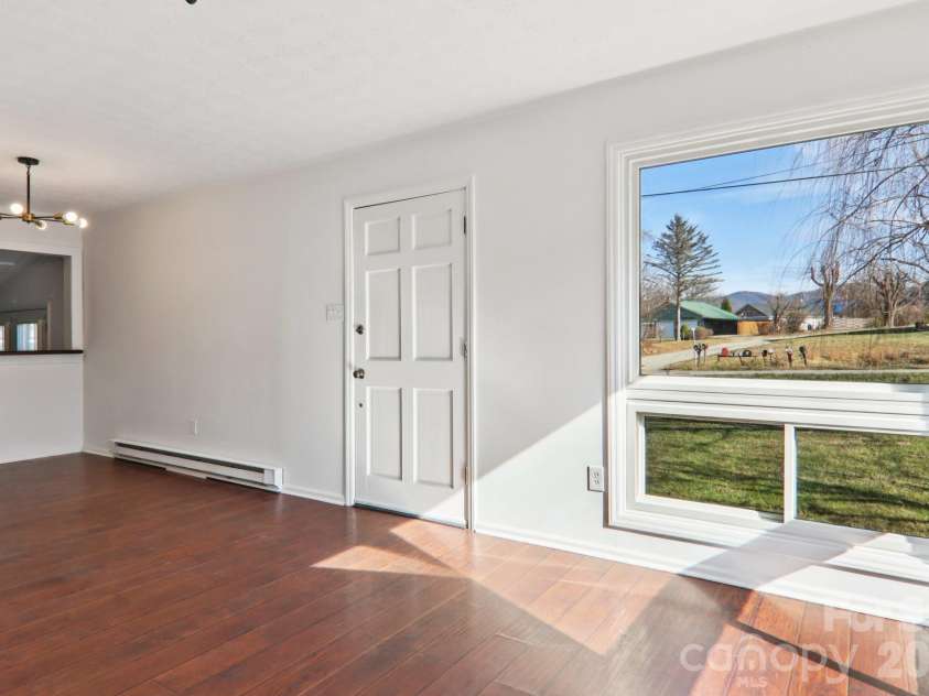591 Blue Ridge Road, Black Mountain, NC 28711.  MLS# CAR4320573, YatesRealty ID 2436. Front door and dining nook