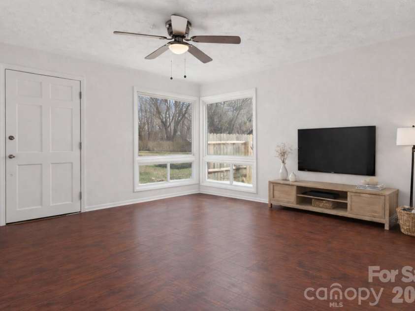 591 Blue Ridge Road, Black Mountain, NC 28711.  MLS# CAR4320573, YatesRealty ID 2436. Living area looking towards front and side yard  Virtually staged