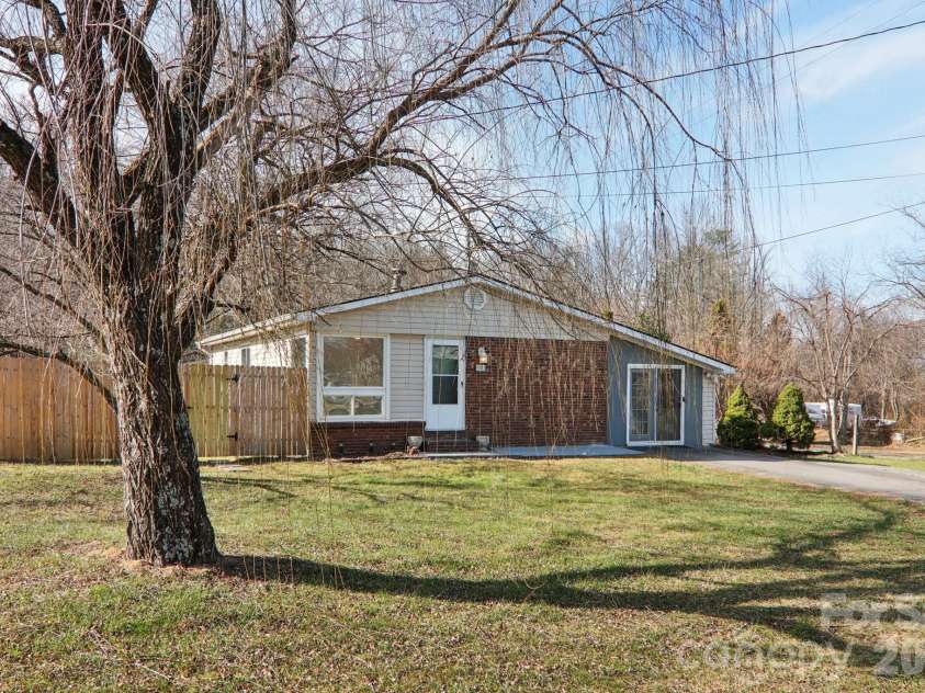 591 Blue Ridge Road, Black Mountain, NC 28711.  MLS# CAR4320573, YatesRealty ID 2436. Mature tree and fenced side yard
