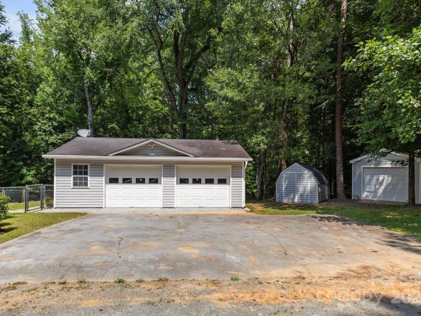 7011 Providence Road, Waxhaw, NC 28173.  MLS# CAR4271791, YatesRealty ID 24363. Detached garage and two storage buildings