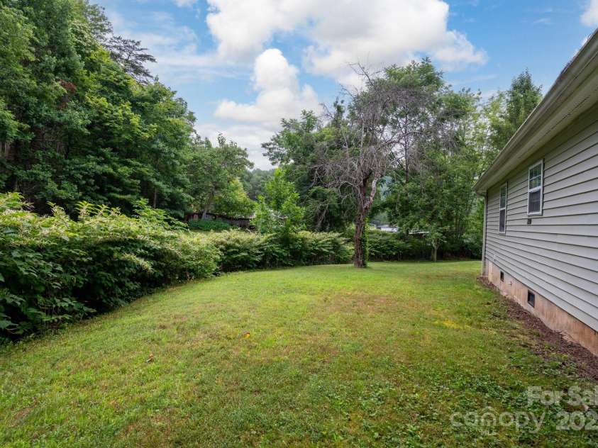 147 Mink Farm Road, Leicester, NC 28748.  MLS# CAR4276189, YatesRealty ID 24366. Flat, Level Yard