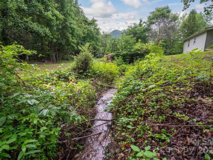 147 Mink Farm Road, Leicester, NC 28748.  MLS# CAR4276189, YatesRealty ID 24366. Property Borders Running Creek