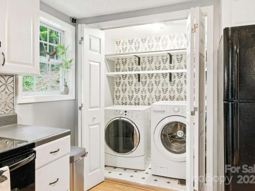 147 Mink Farm Road, Leicester, NC 28748.  MLS# CAR4276189, YatesRealty ID 24366. Washer-Dryer Closet in Kitchen