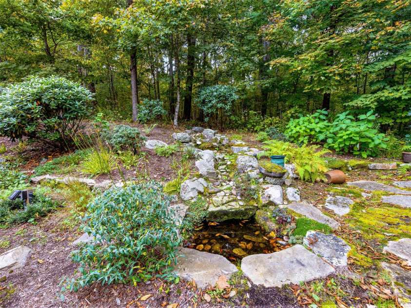 616 Old Growth Forest Road, Burnsville, NC 28714.  MLS# CAR4076276, YatesRealty ID 2437. A garden graced with this water feature...