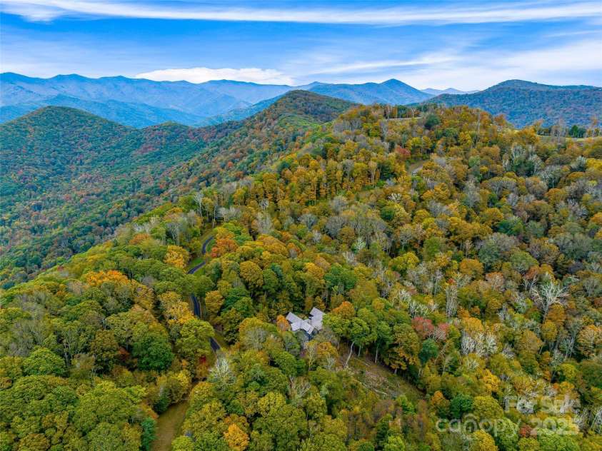 616 Old Growth Forest Road, Burnsville, NC 28714.  MLS# CAR4076276, YatesRealty ID 2437. A Spectacular home (in the center middle of this aerial) in the private gated Mountain Air community!