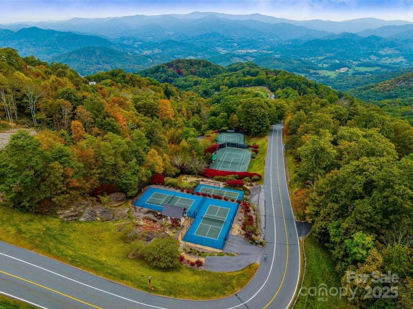 616 Old Growth Forest Road, Burnsville, NC 28714.  MLS# CAR4076276, YatesRealty ID 2437. Mountain Air's Country Club amenities are boundless - such as the tennis courts and the pickleball courts...