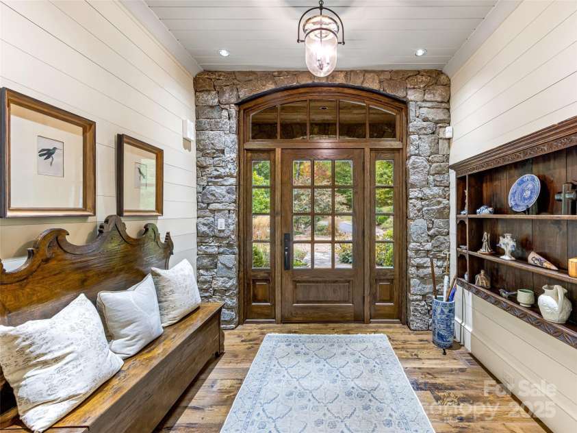 616 Old Growth Forest Road, Burnsville, NC 28714.  MLS# CAR4076276, YatesRealty ID 2437. So let's start at the beginning...the grand entrance with a hand stacked stone surround, reclaimed oak hardwood floors and built ins.