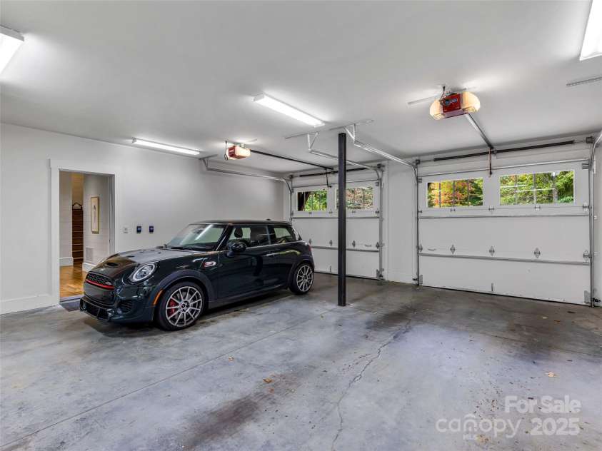 616 Old Growth Forest Road, Burnsville, NC 28714.  MLS# CAR4076276, YatesRealty ID 2437. Your convenient oeversized two car garage on the main level
