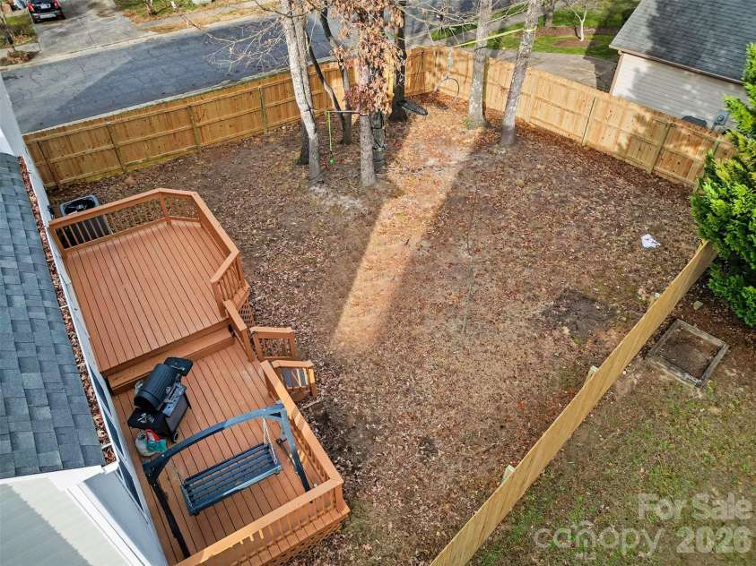 6603 Allness Glen Lane, Charlotte, NC 28269.  MLS# CAR4333202, YatesRealty ID 2438. Aerial of deck & fenced-in yard