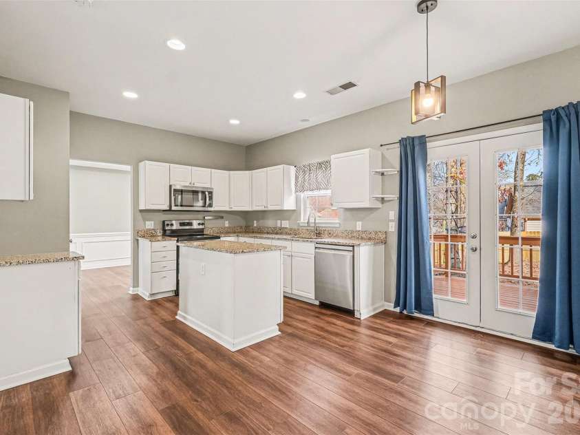 6603 Allness Glen Lane, Charlotte, NC 28269.  MLS# CAR4333202, YatesRealty ID 2438. Dining area & kitchen