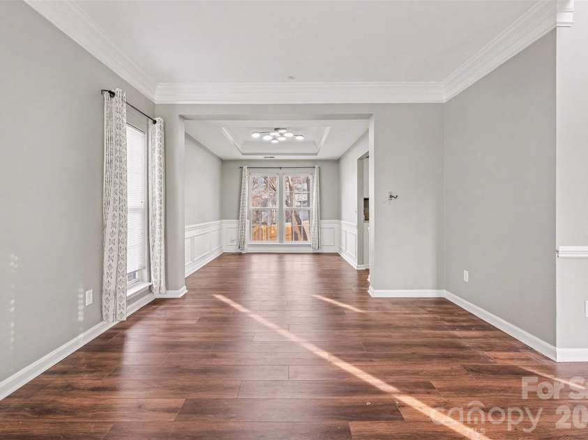 6603 Allness Glen Lane, Charlotte, NC 28269.  MLS# CAR4333202, YatesRealty ID 2438. Formal living room into dining room