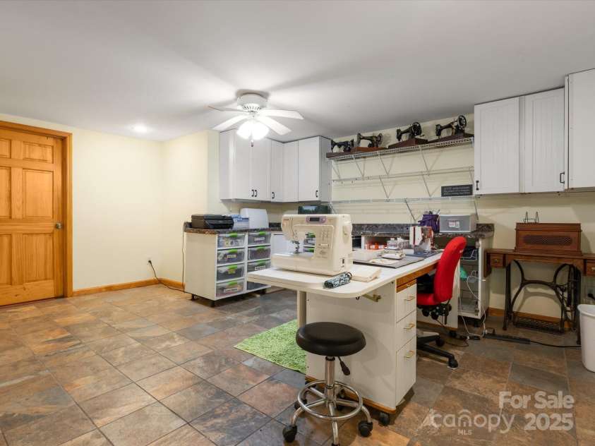 2981 Heath Peak Road, Waynesville, NC 28785.  MLS# CAR4266854, YatesRealty ID 24381. Craft room in the basement