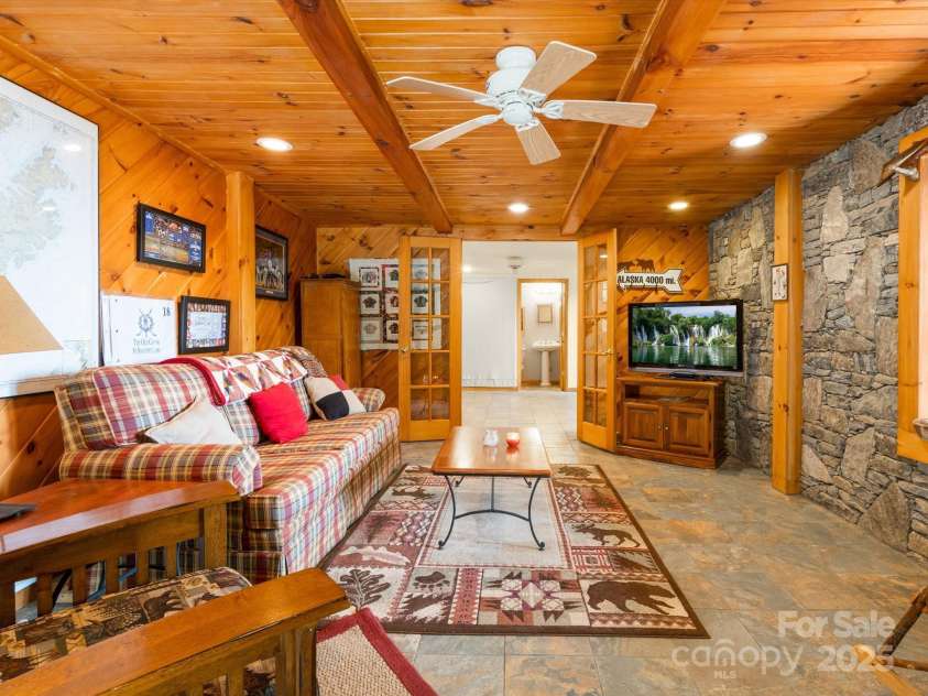 2981 Heath Peak Road, Waynesville, NC 28785.  MLS# CAR4266854, YatesRealty ID 24381. Den room in basement
