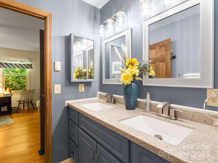 2981 Heath Peak Road, Waynesville, NC 28785.  MLS# CAR4266854, YatesRealty ID 24381. Double sinks in the primary ensuite bathroom