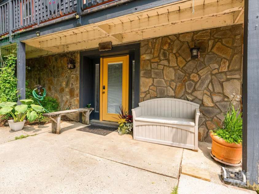2981 Heath Peak Road, Waynesville, NC 28785.  MLS# CAR4266854, YatesRealty ID 24381. Exterior entrance to basement