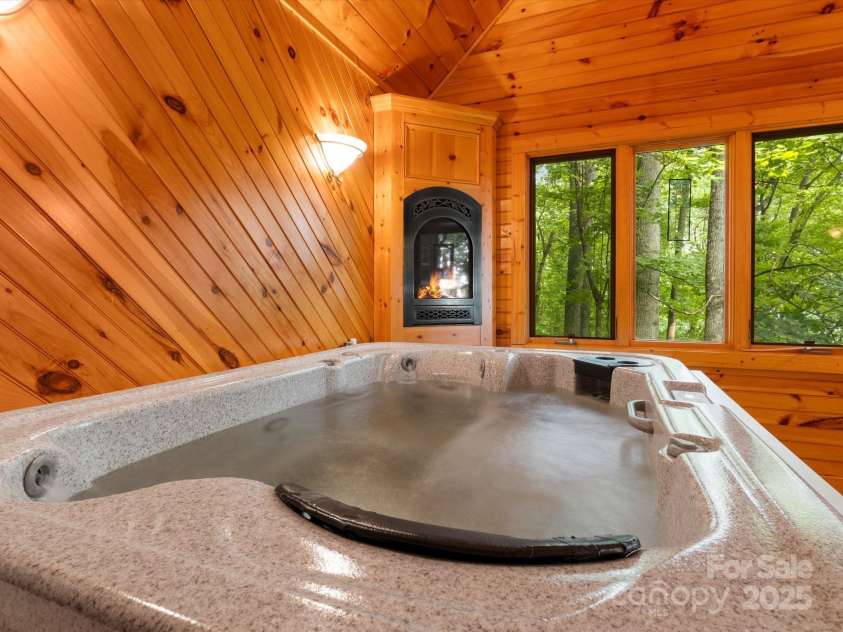 2981 Heath Peak Road, Waynesville, NC 28785.  MLS# CAR4266854, YatesRealty ID 24381. Indoor hot tub room off the primary
