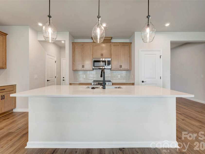 707 Bowery Place, Cramerton, NC 28032.  MLS# CAR4385373, YatesRealty ID 24381. Light filled kitchen with ample storage