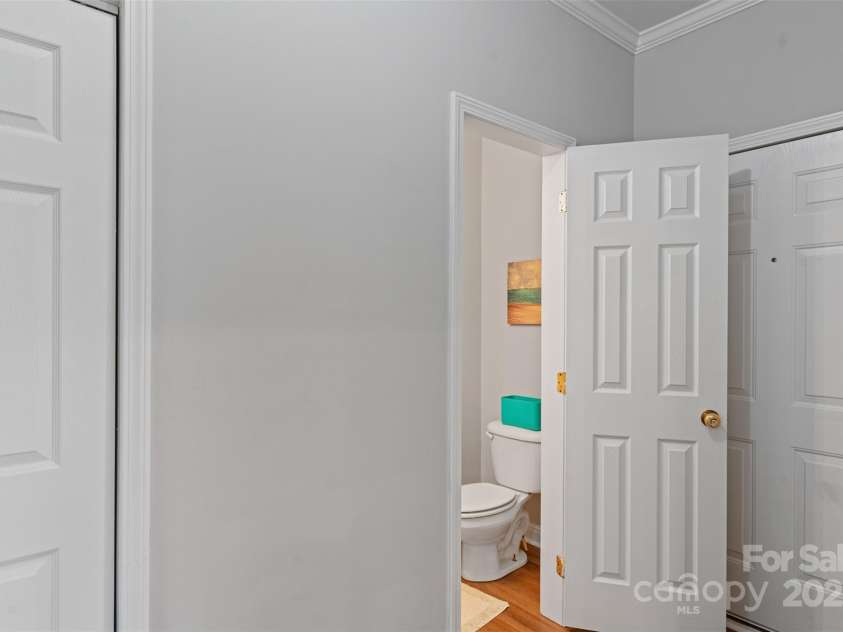 7019 Walnut Ridge Court, Charlotte, NC 28217.  MLS# CAR4210878, YatesRealty ID 24383. Half bath from hallway