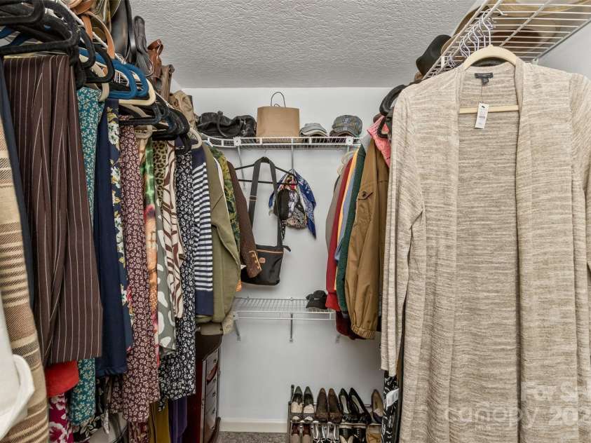 301 Theron Court, Candler, NC 28715.  MLS# CAR4250972, YatesRealty ID 24385. Large, well organized walk in closet in the primary bath