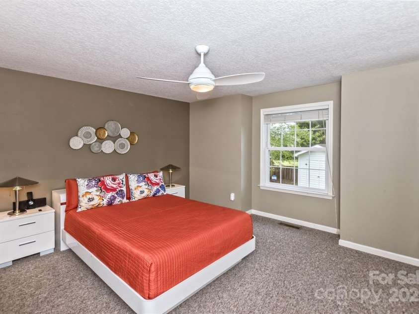 301 Theron Court, Candler, NC 28715.  MLS# CAR4250972, YatesRealty ID 24385. Primary bedroom, spacious, restful, just lovely