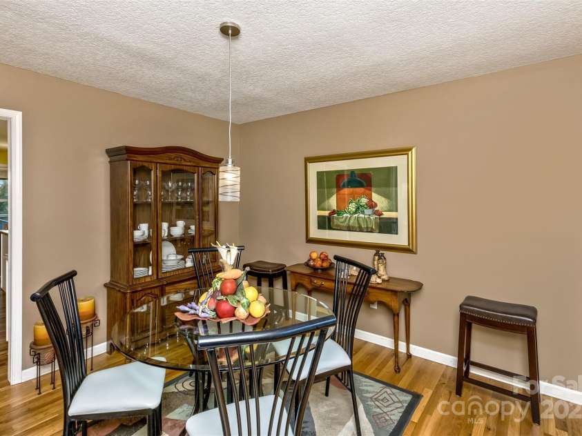 301 Theron Court, Candler, NC 28715.  MLS# CAR4250972, YatesRealty ID 24385. The dining room is adjacent to the kitchen