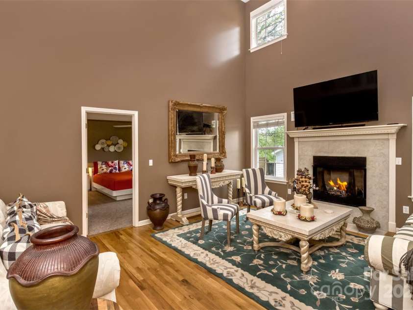 301 Theron Court, Candler, NC 28715.  MLS# CAR4250972, YatesRealty ID 24385. The primary bedroom is just off the great room
