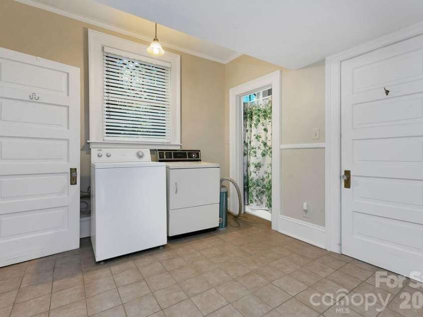 208 Probart Street, Brevard, NC 28712.  MLS# CAR4384508, YatesRealty ID 24387. Laundry with Bathroom