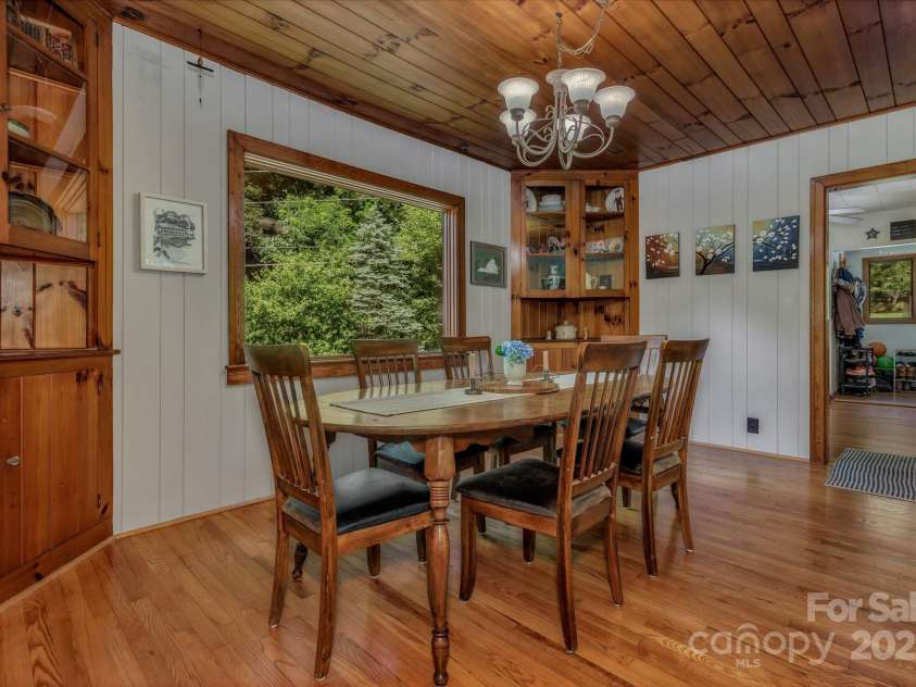 111 Assembly Drive, Montreat, NC 28757.  MLS# CAR4271152, YatesRealty ID 24388. Dining room with a large picture window and build in corner cabinets.