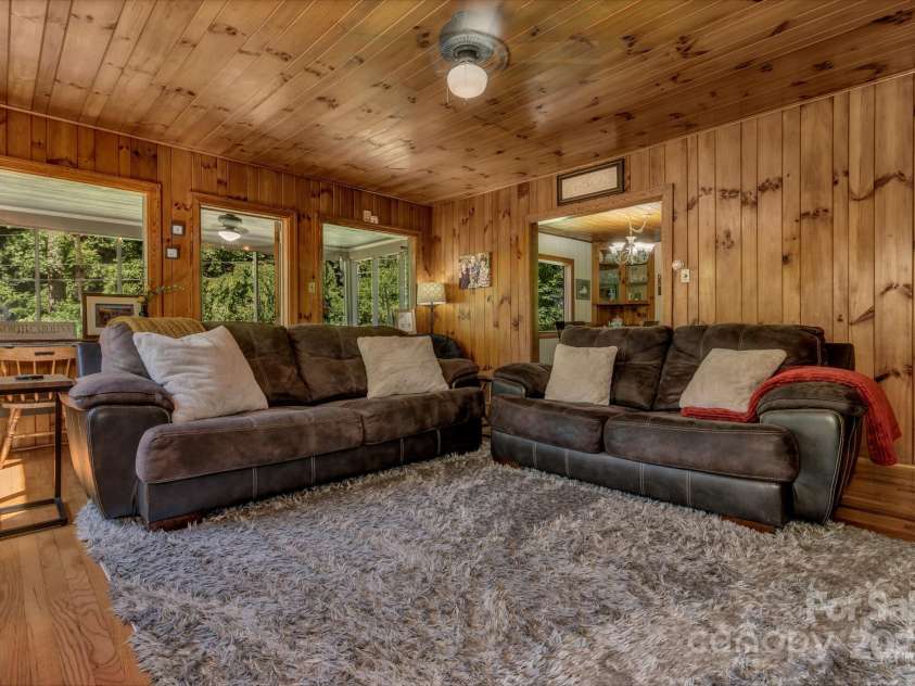 111 Assembly Drive, Montreat, NC 28757.  MLS# CAR4271152, YatesRealty ID 24388. The living room is surrounded by natural light.