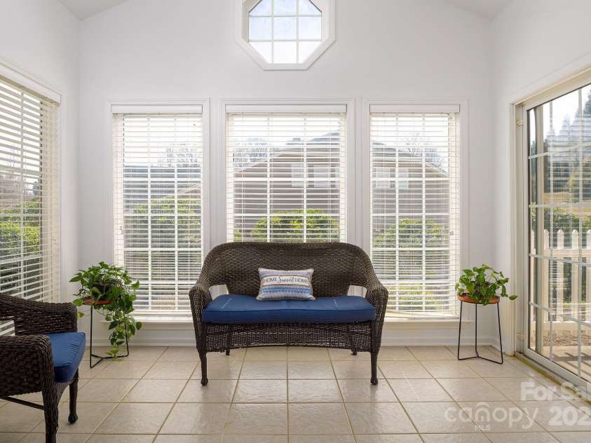 111 Brickwalk Court, Mocksville, NC 27028.  MLS# CAR4235058, YatesRealty ID 2439. Abundance of windows allow natural light to flood the space. Slider doors open to fenced patio