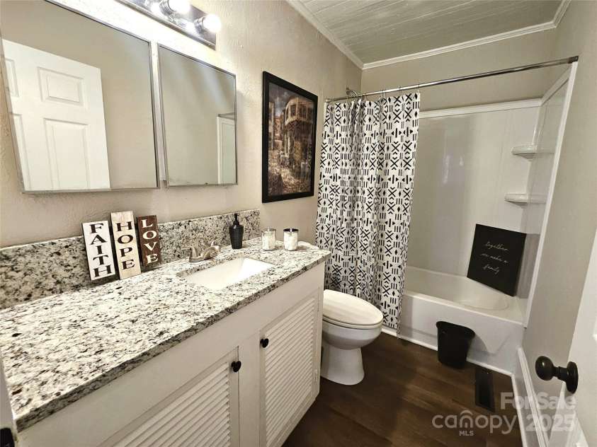 169 Freeze Avenue, Concord, NC 28025.  MLS# CAR4254472, YatesRealty ID 24392. Bath one with granite counters.
