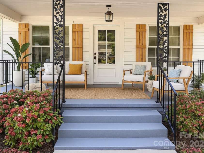 169 Freeze Avenue, Concord, NC 28025.  MLS# CAR4254472, YatesRealty ID 24392. Rocking chair front porch