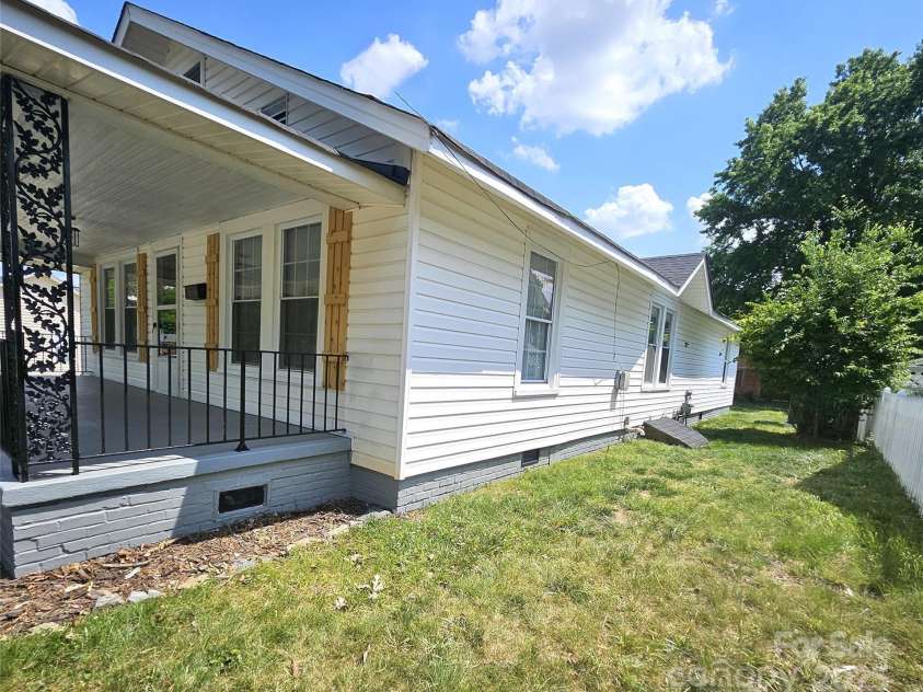 169 Freeze Avenue, Concord, NC 28025.  MLS# CAR4254472, YatesRealty ID 24392. Side one of home.