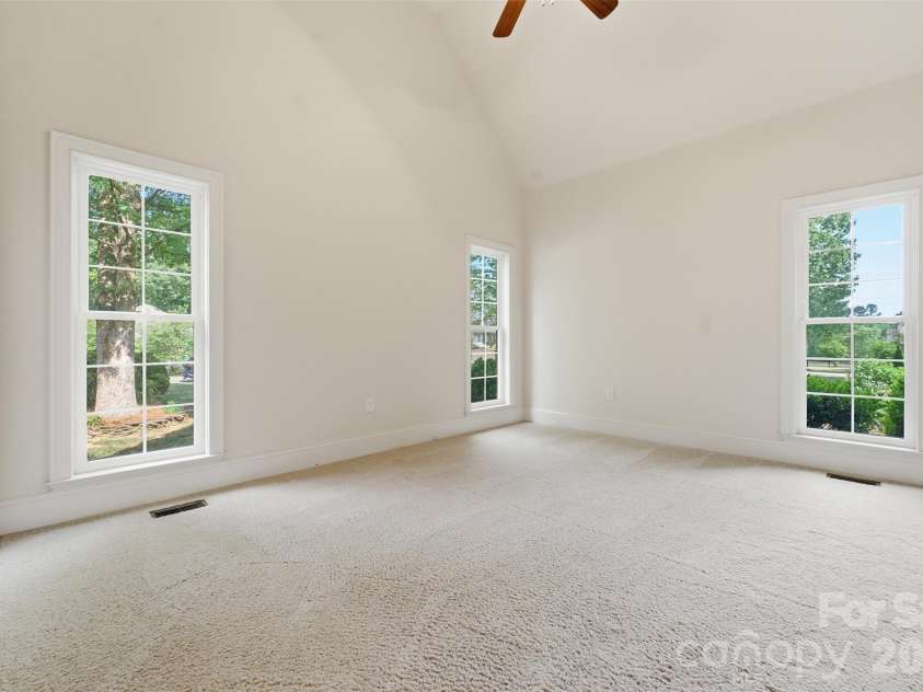 279 Woodstream Circle, Mooresville, NC 28117.  MLS# CAR4370346, YatesRealty ID 24395. Front room with vaulted ceiling great for office, play room, study...