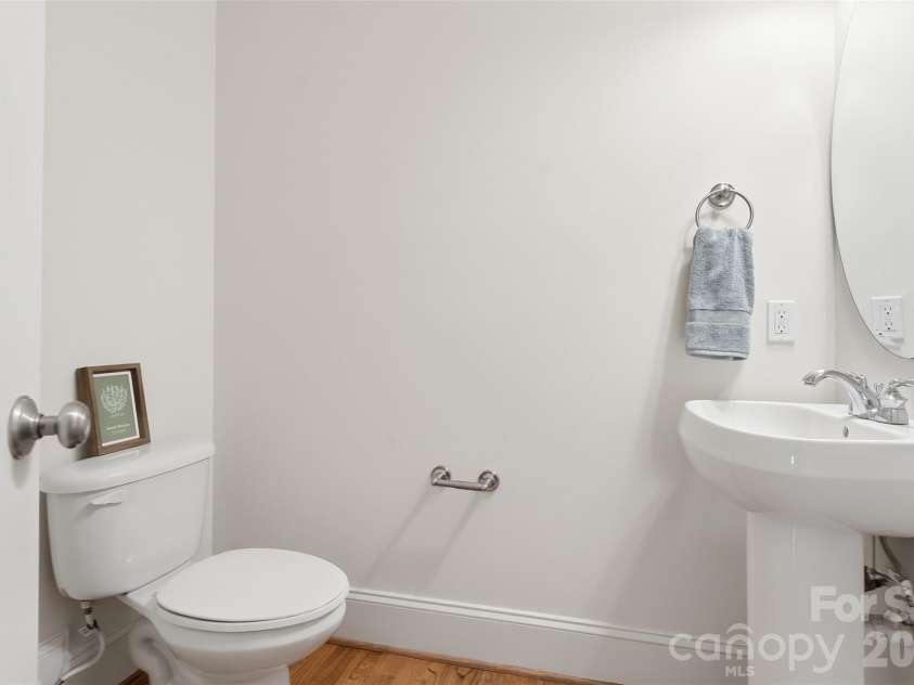 279 Woodstream Circle, Mooresville, NC 28117.  MLS# CAR4370346, YatesRealty ID 24395. Half bath just inside garage door entry