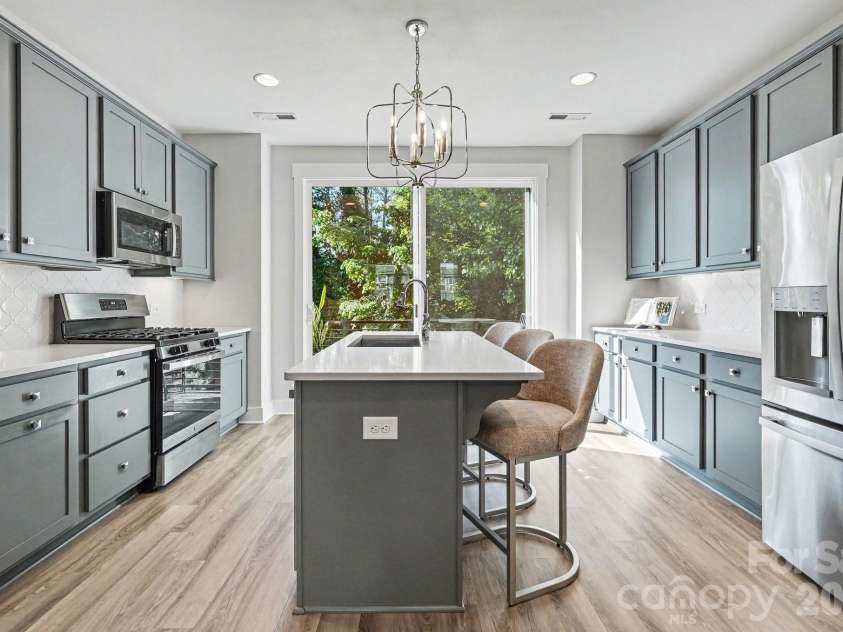 562 West End Drive, Charlotte, NC 28208.  MLS# CAR4375491, YatesRealty ID 24398. Elegant fixtures with undermount lighting