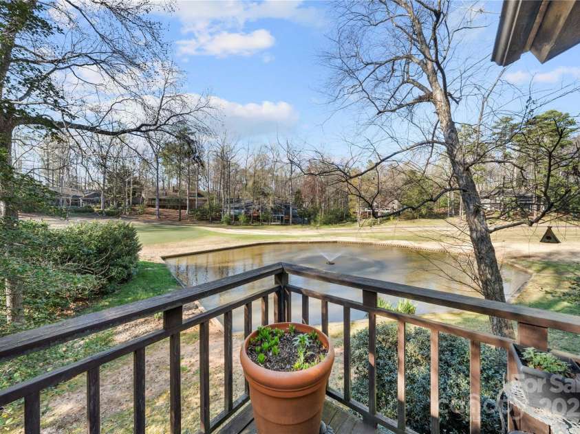 32 Fairway Ridge, Lake Wylie, SC 29710.  MLS# CAR4234343, YatesRealty ID 24400. View of golf course pond from deck on main floor level