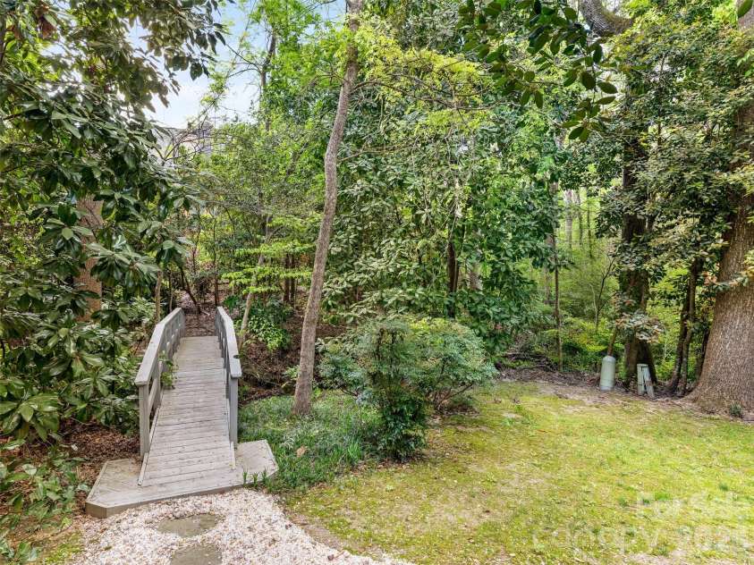 5239 Winding Brook Road, Charlotte, NC 28226.  MLS# CAR4366118, YatesRealty ID 24410. Picturesque Bridge - Yard extends beyond bridge