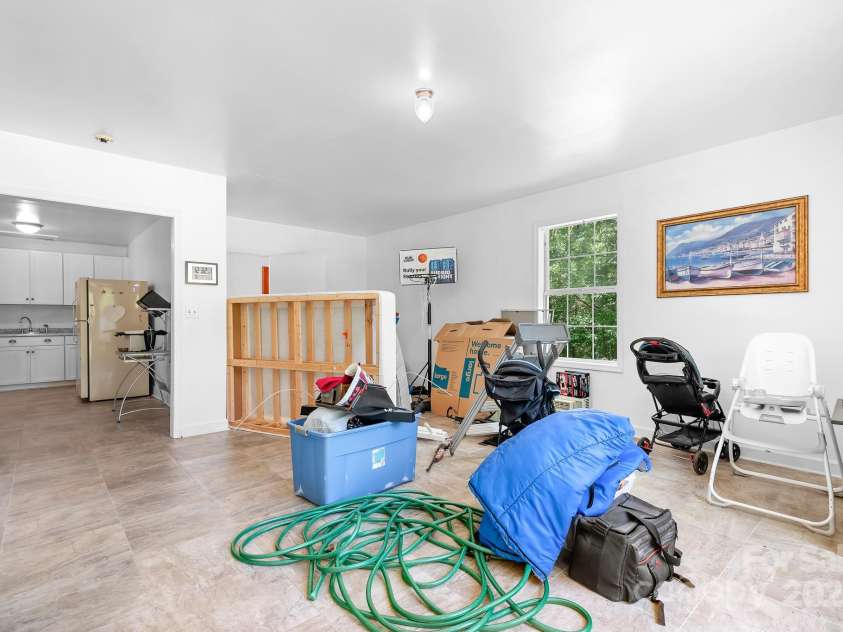 6601 Charlotte Highway, York, SC 29745.  MLS# CAR4274584, YatesRealty ID 24421. Living room of ADU currently using for storage