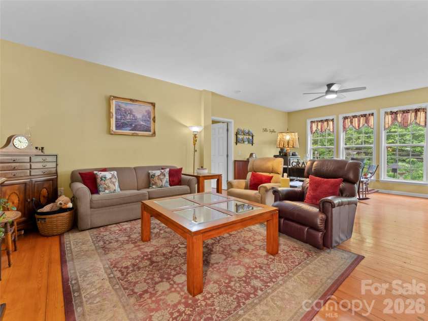103 Old Southside Road, Saluda, NC 28773.  MLS# CAR4376836, YatesRealty ID 24422. Living room with large windows.