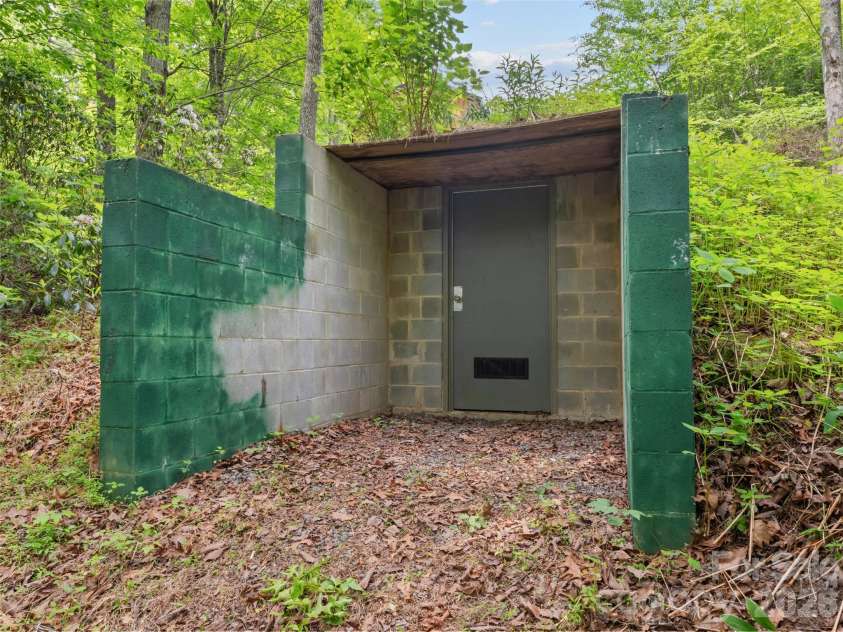 103 Old Southside Road, Saluda, NC 28773.  MLS# CAR4376836, YatesRealty ID 24422. Root cellar outside