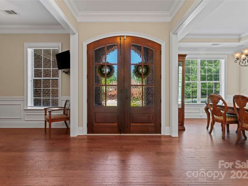 1400 Delaney Drive, Matthews, NC 28104.  MLS# CAR4255210, YatesRealty ID 24424. Foyer entry facing front door