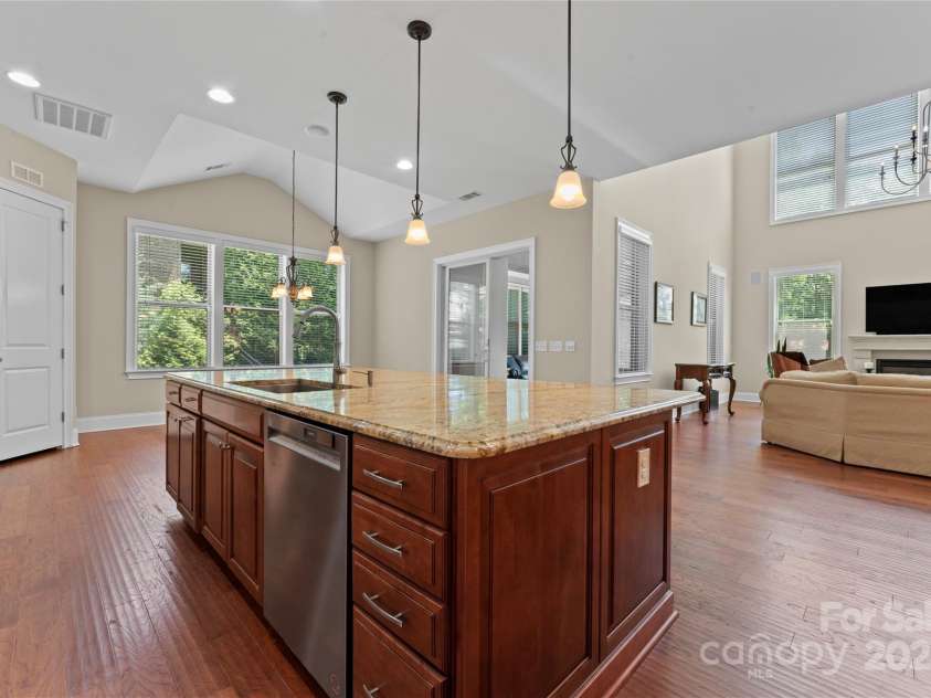 1400 Delaney Drive, Matthews, NC 28104.  MLS# CAR4255210, YatesRealty ID 24424. Kitchen w/view of Great Room
