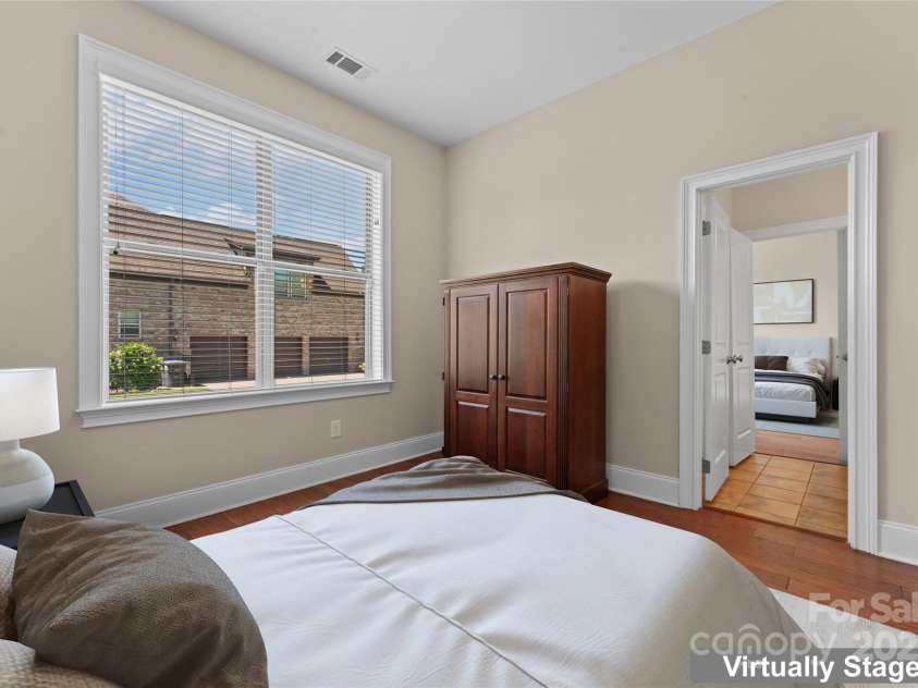 1400 Delaney Drive, Matthews, NC 28104.  MLS# CAR4255210, YatesRealty ID 24424. Main level Jack n Jill bedroom #1 (virtually staged)