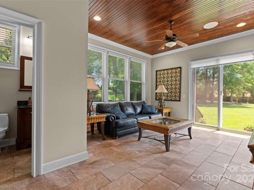 1400 Delaney Drive, Matthews, NC 28104.  MLS# CAR4255210, YatesRealty ID 24424. Sun Room with half bath