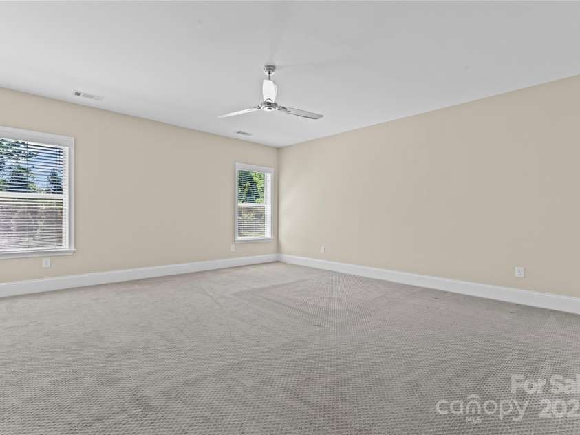 1400 Delaney Drive, Matthews, NC 28104.  MLS# CAR4255210, YatesRealty ID 24424. Upstairs bedroom (as is)