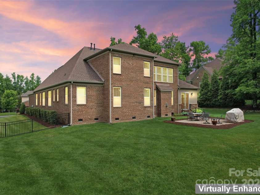 1400 Delaney Drive, Matthews, NC 28104.  MLS# CAR4255210, YatesRealty ID 24424. Virtually enhanced dusk view