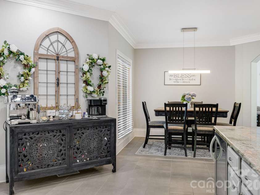 2 Sterling Run Drive, Fletcher, NC 28732.  MLS# CAR4377297, YatesRealty ID 24426. Serving dinner in this open kitchen/dining concept is a breeze