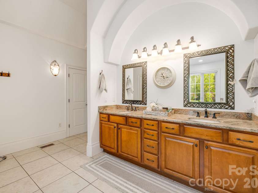 2 Sterling Run Drive, Fletcher, NC 28732.  MLS# CAR4377297, YatesRealty ID 24426. This vanity has perfect lighting, and ample storage for every artifact in your morning routine