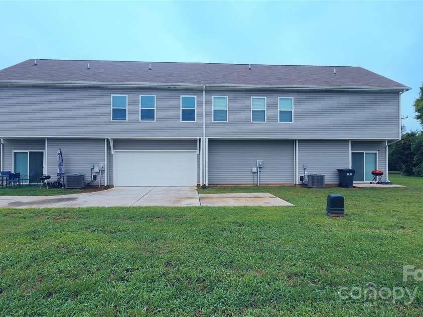 14727 Choate Circle, Charlotte, NC 28273.  MLS# CAR4287456, YatesRealty ID 2443. Back view from the flat, expansive backyard